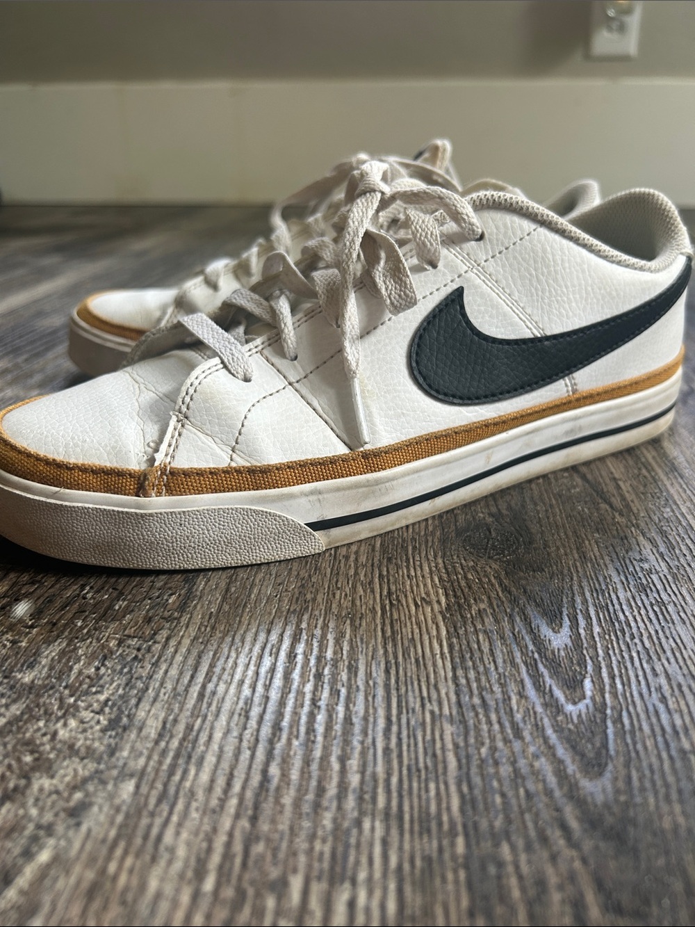 Nike White Low-Top Sneakers with Black Swoosh and Tan Accents